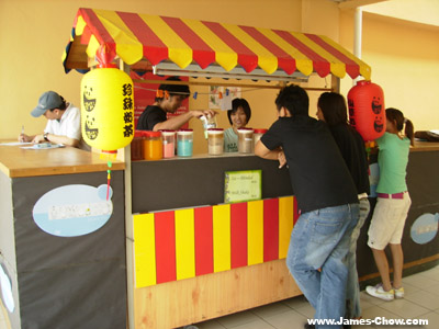 People helping out at the stall